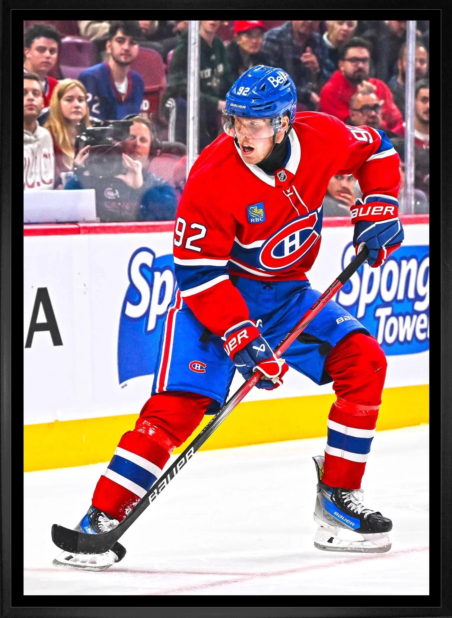 Montreal Canadiens hockey player in red jersey skating on ice during game
