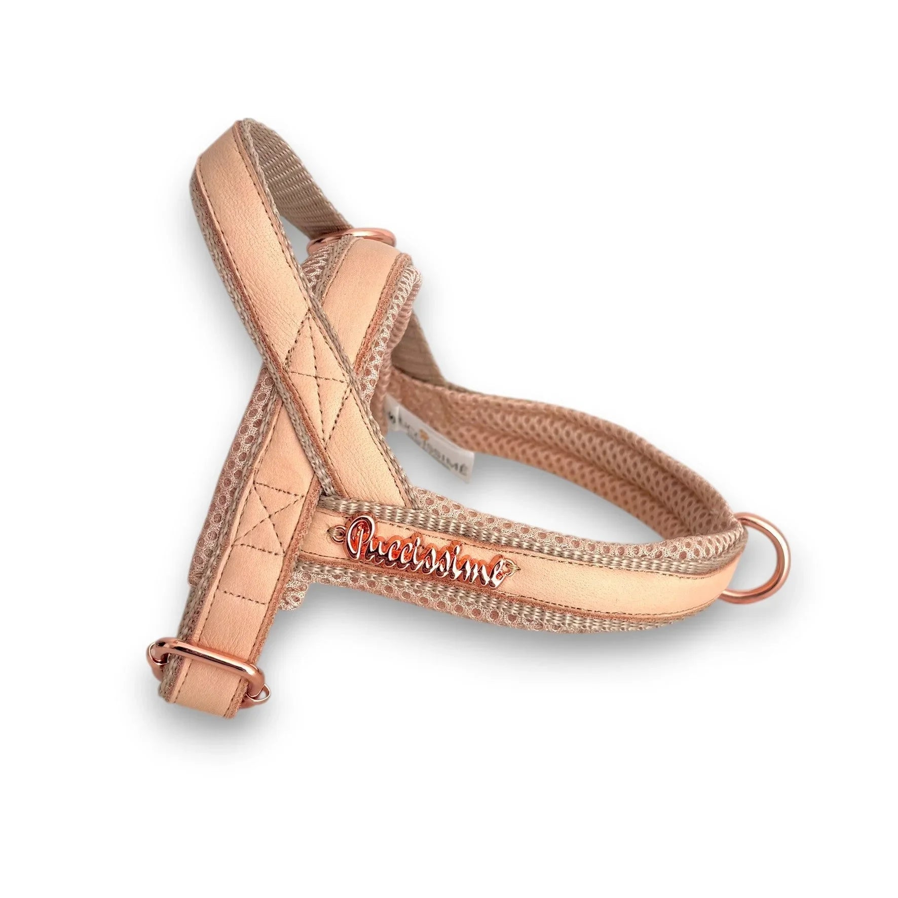Reflective peach dog harness with rose gold hardware and Puccissimo logo on white background