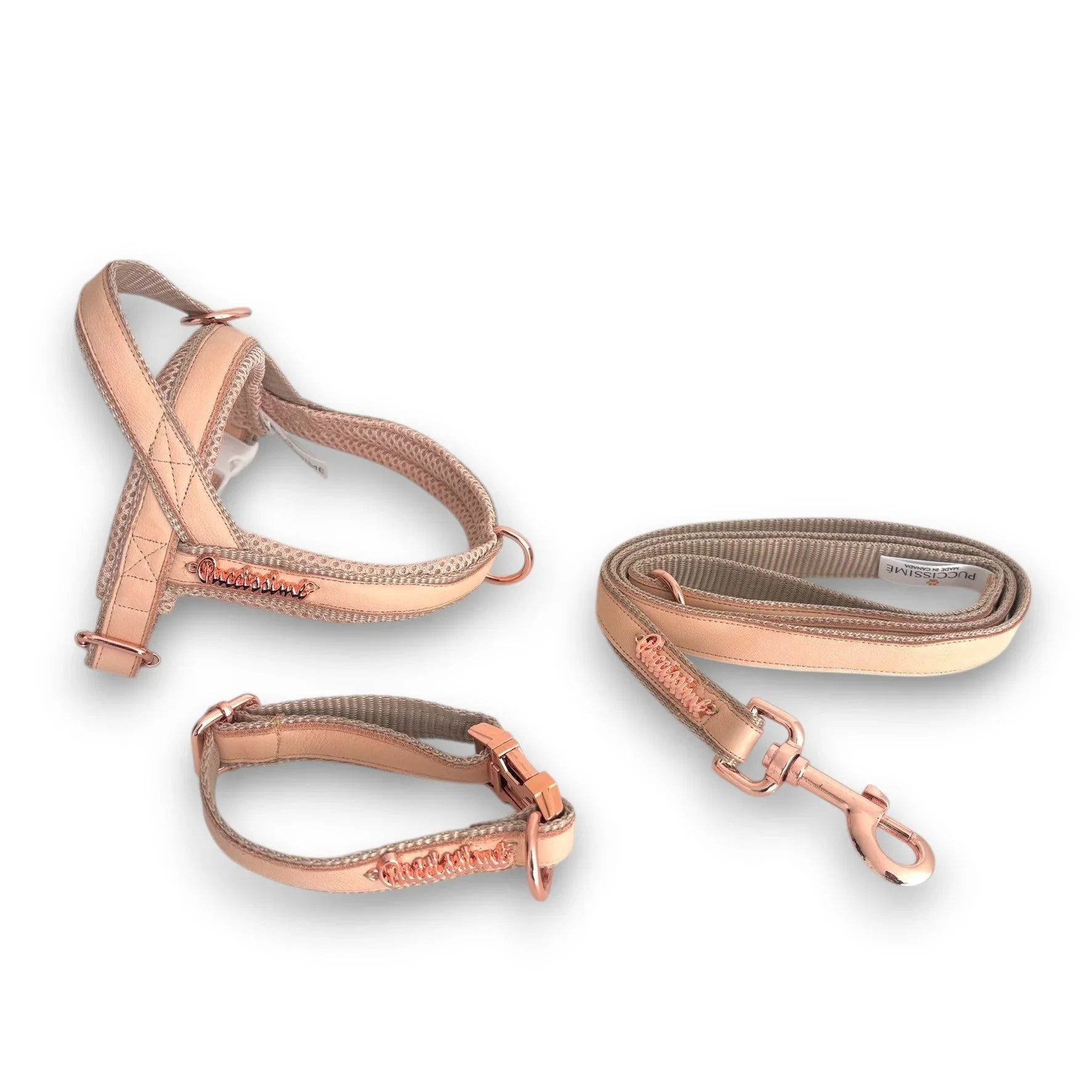 Reflective dog harness, collar, and leash set in rose gold on white background