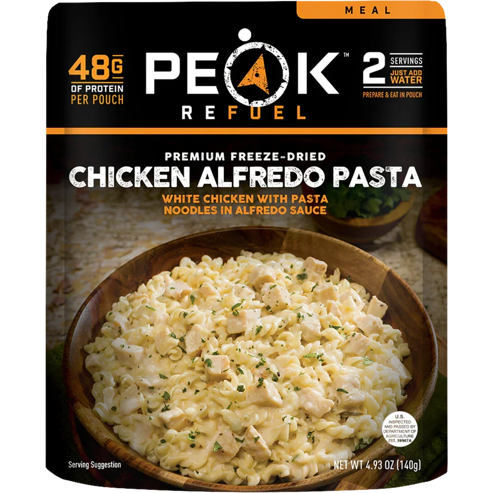 Peak Refuel Chicken Alfredo Pasta freeze-dried meal pouch with creamy pasta and chicken in a bowl
