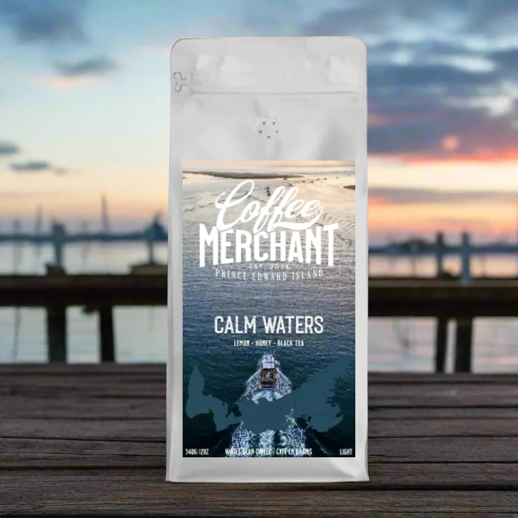 Coffee Merchant Calm Waters coffee bag on dock with waterfront sunset background