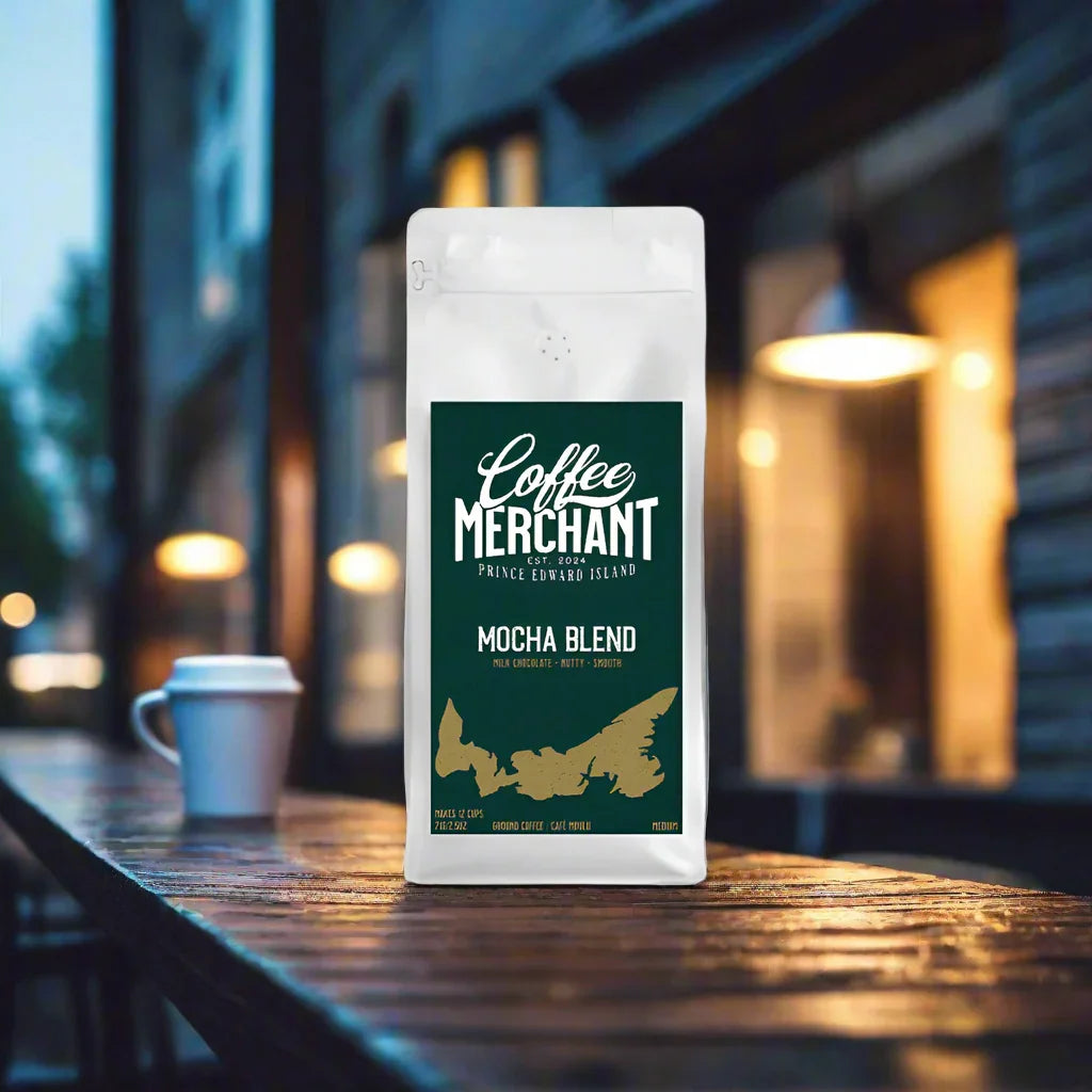 Coffee Merchant Mocha Blend bag on outdoor café table, cup in the background