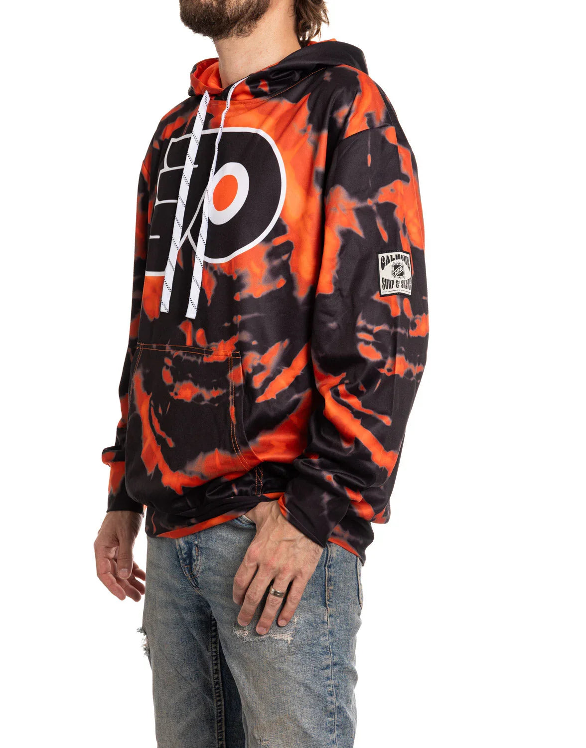 Man wearing orange and black Philadelphia Flyers sublimation hoodie and ripped jeans