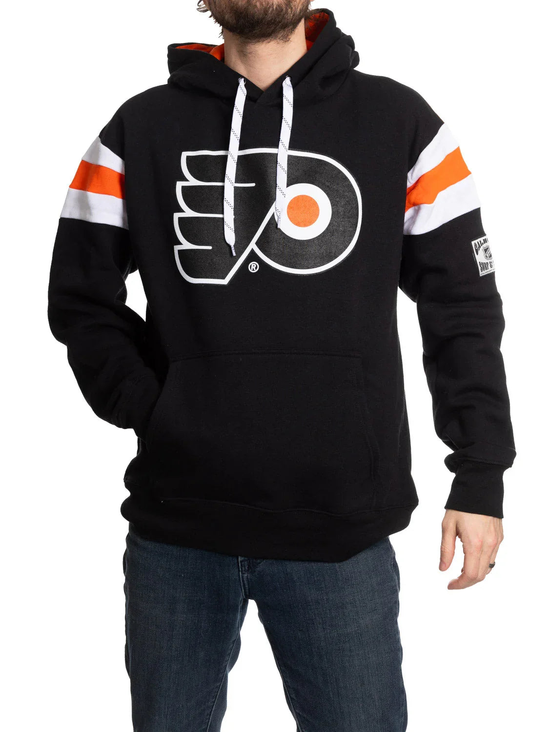 Man wearing a black Philadelphia Flyers hoodie with orange and white sleeve stripes