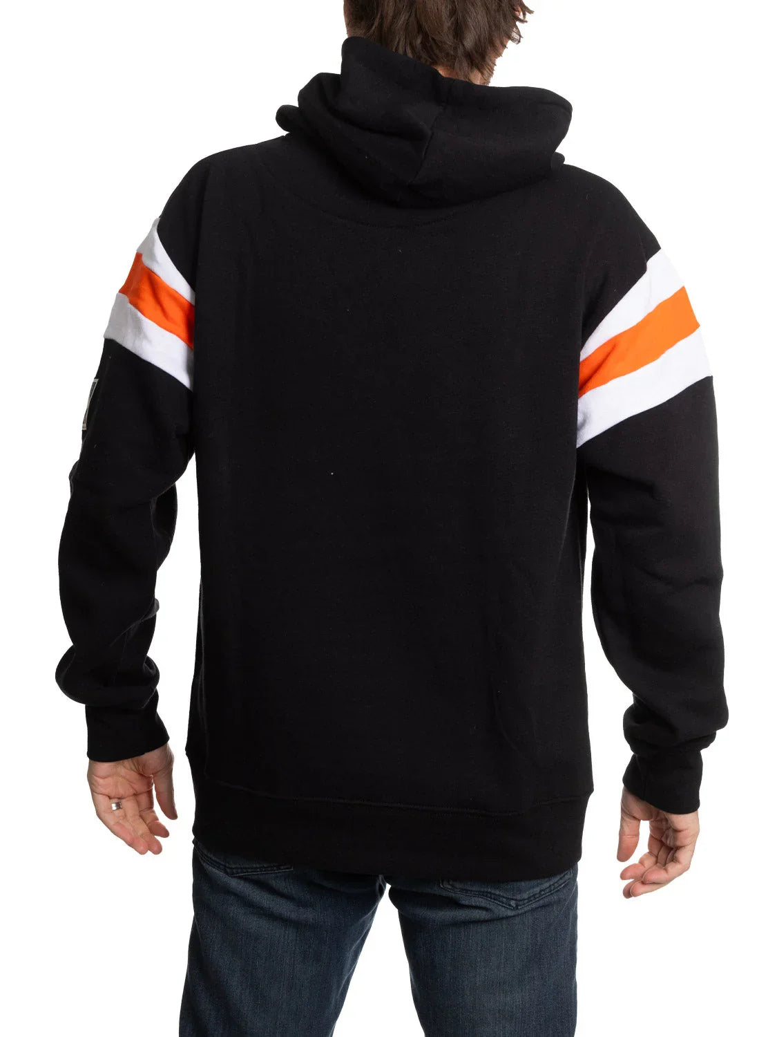 Man wearing black hoodie with orange and white sleeve stripes, back view