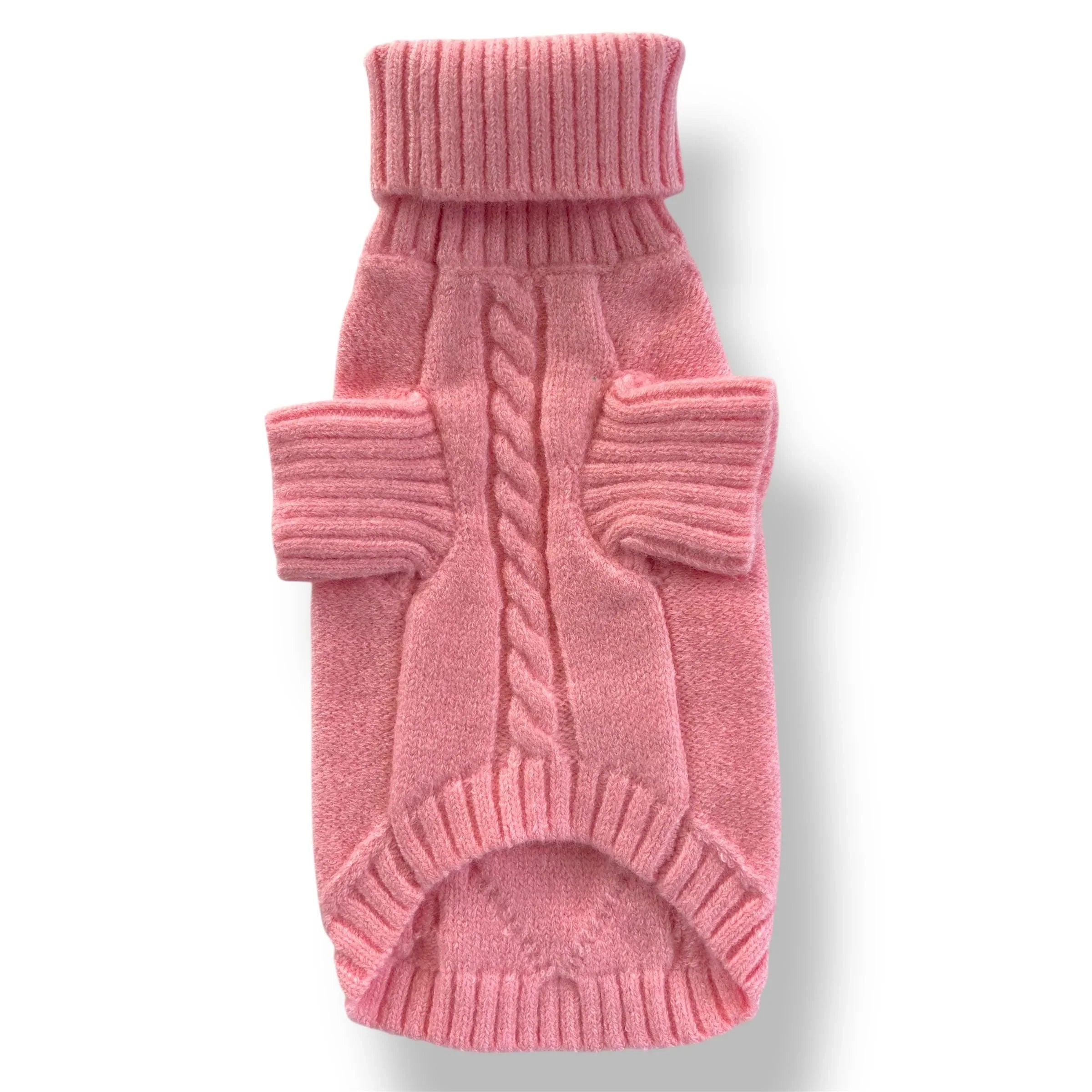 Pink cable knit dog sweater with turtleneck and ribbed trim on white background