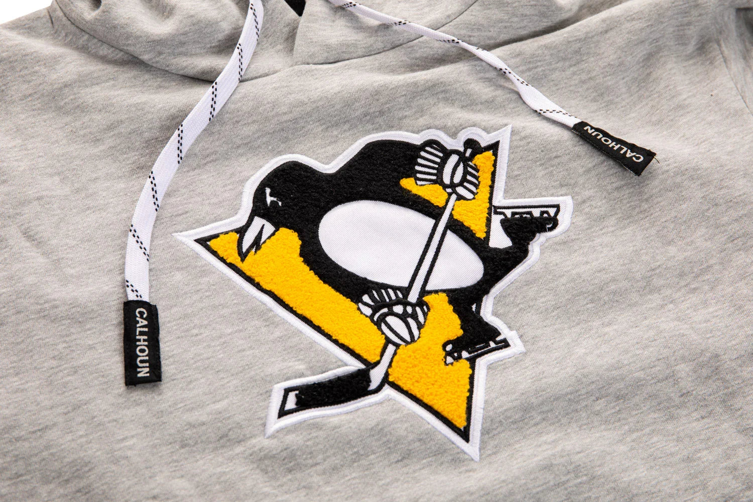 Pittsburgh Penguins logo patch on grey Calhoun hoodie with white drawstrings