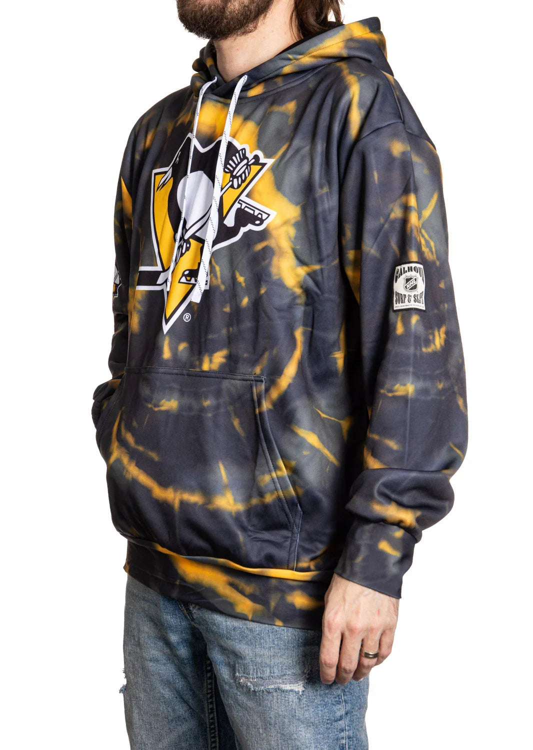 Man wearing Pittsburgh Penguins tie-dye hoodie with logo and front pocket.