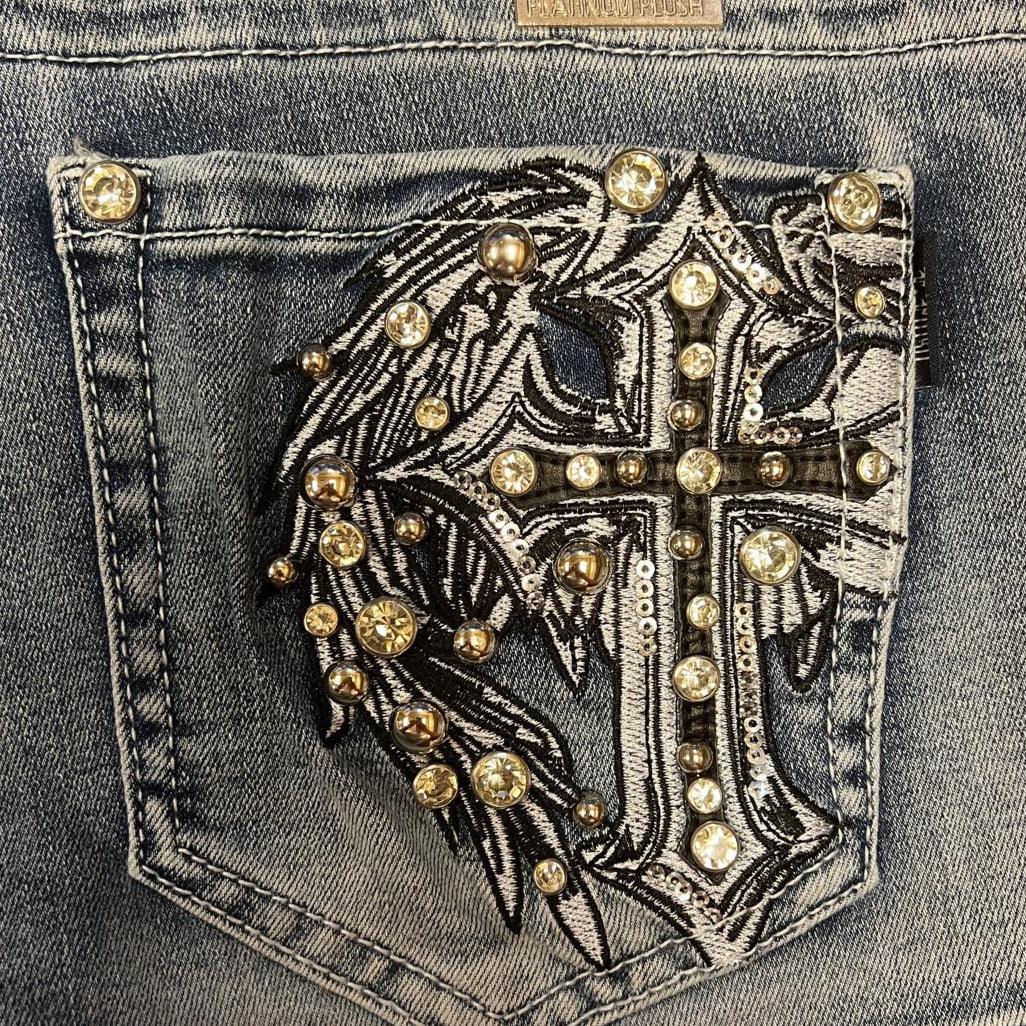 Blue denim jeans pocket with rhinestone and sequin cross patch design
