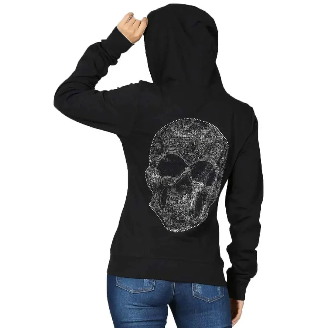 Woman wearing black full zip hoodie with rhinestone skull design on the back