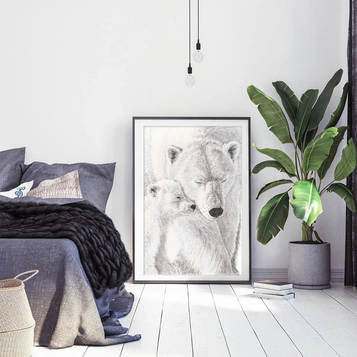 Polar bear with cub illustration framed in modern bedroom with plant and cozy decor
