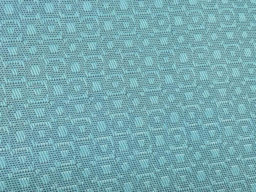 Close-up of light blue woven fabric with geometric pattern for poolside double hammock