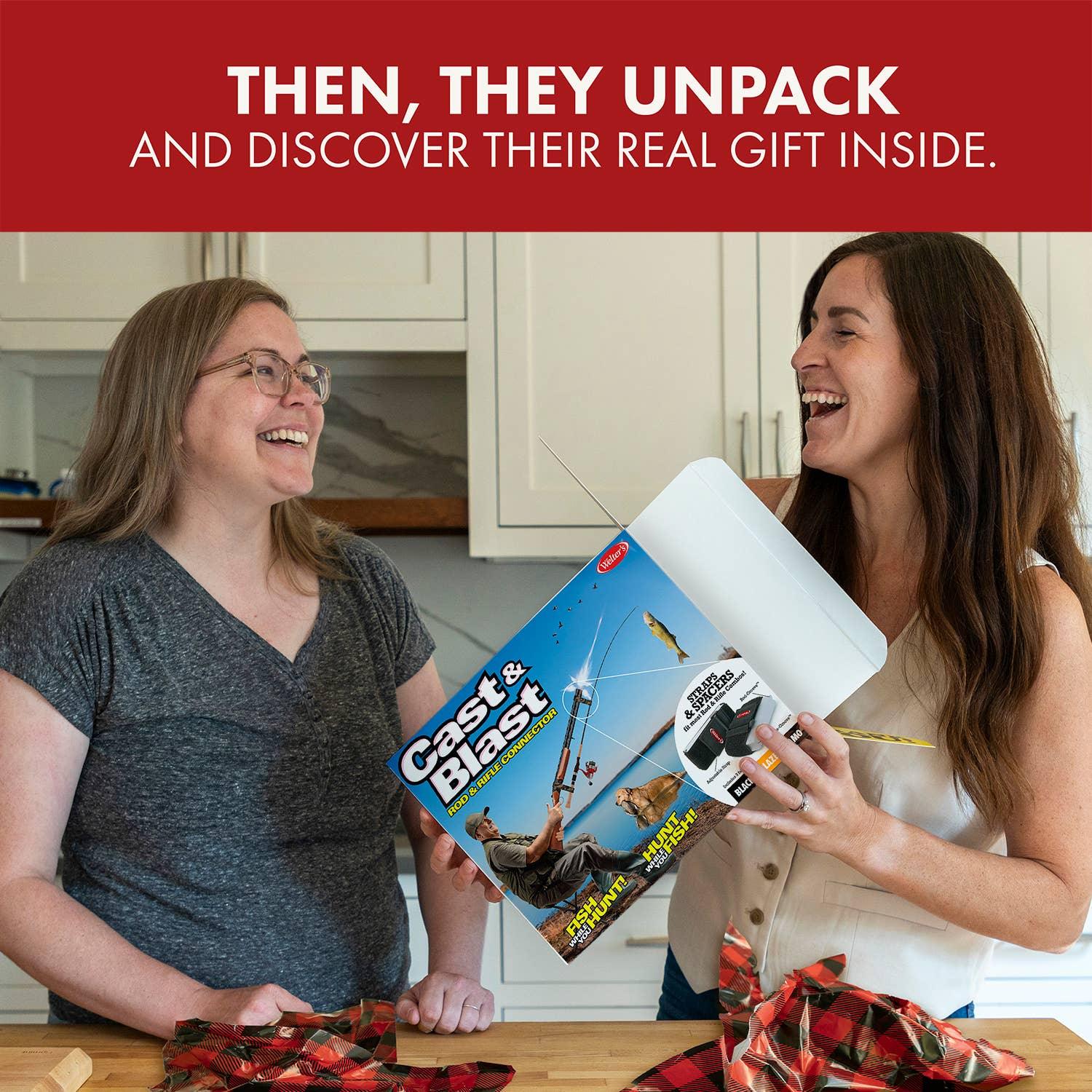 Two women laughing in kitchen with Cast & Blast gift box, unwrapping presents