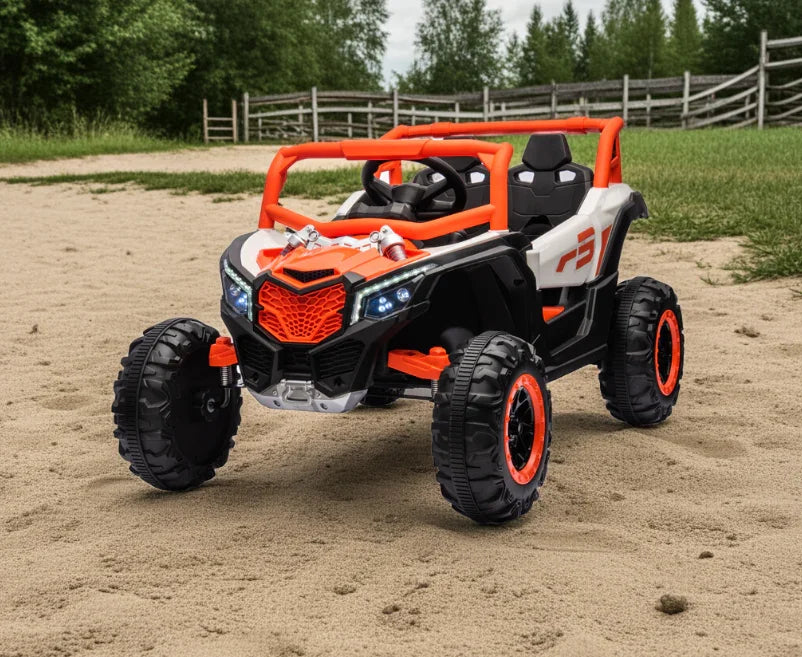 Kids off-road electric ride-on toy car with orange accents on sand outdoors