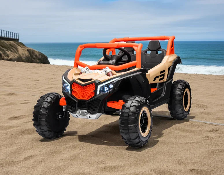 Kids electric ride on car off-road toy vehicle on sandy beach with ocean background