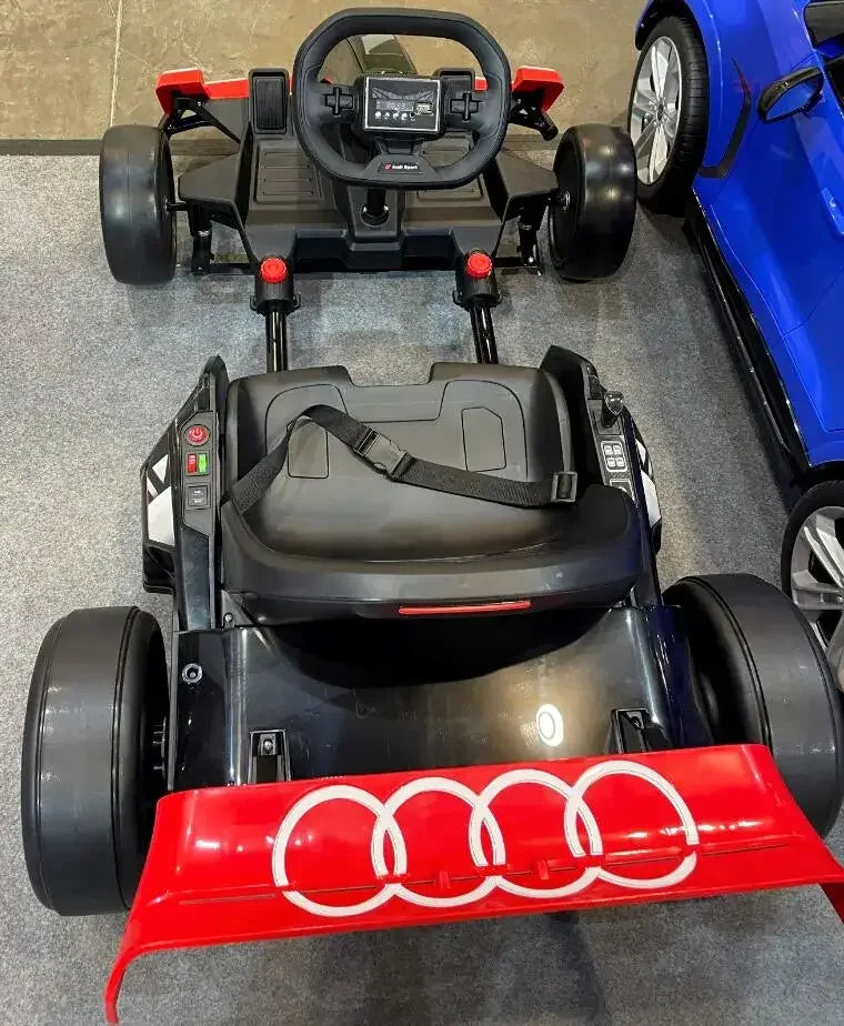 24V Audi licensed electric go-kart ride-on car with red spoiler and Audi logo, indoor display