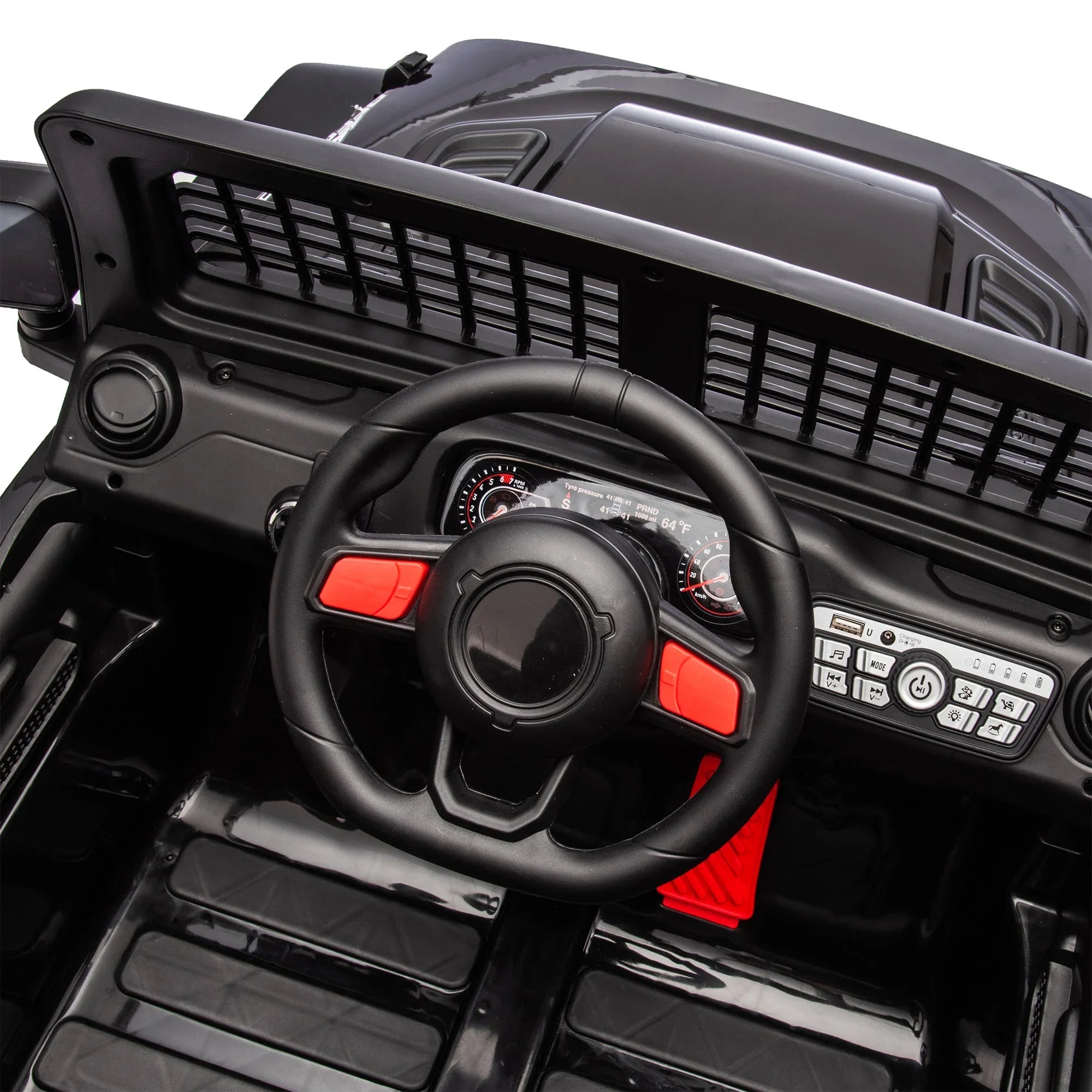 Black toy car dashboard with steering wheel, red accents, and detailed control panel.