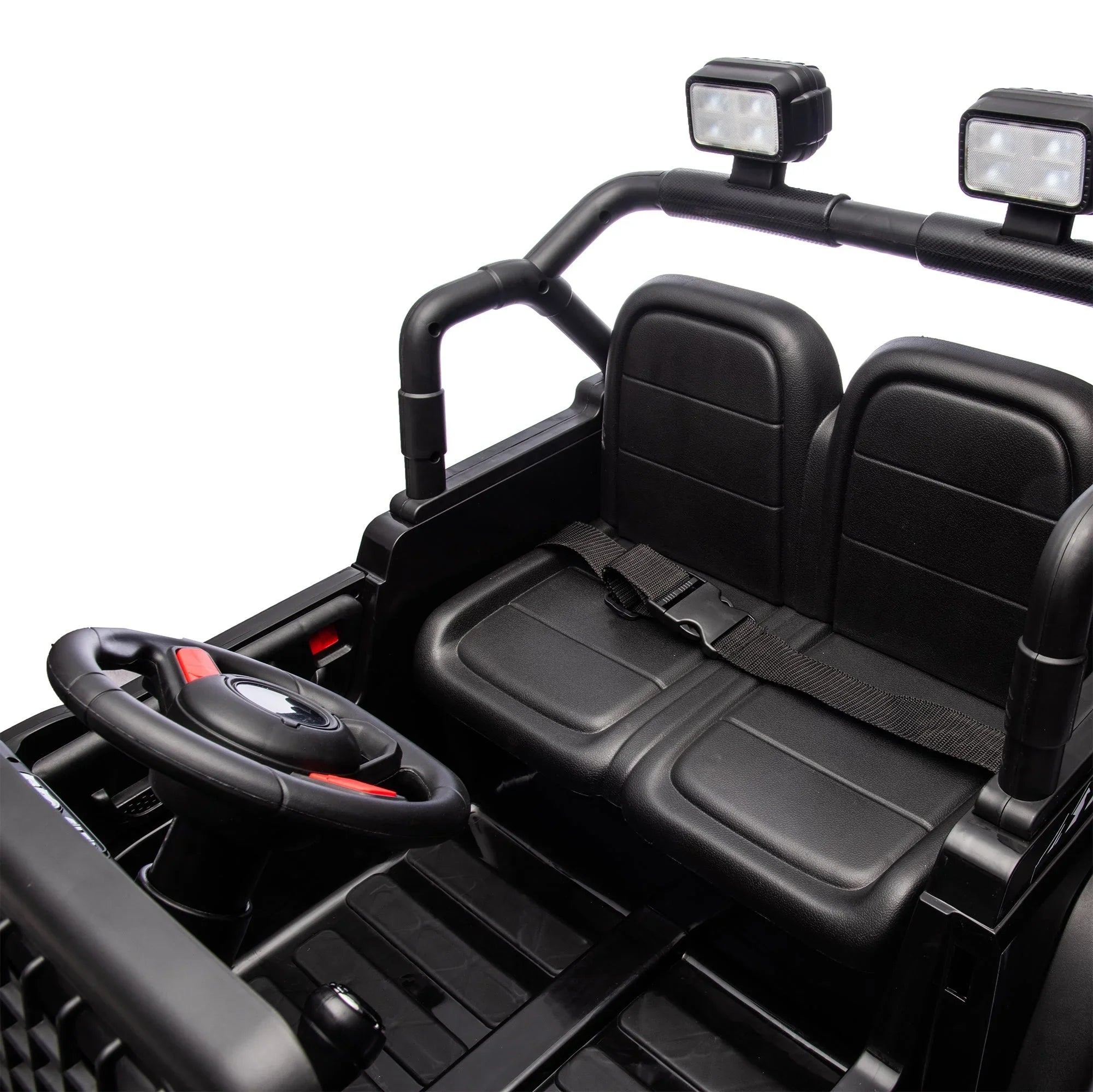Black kids ride-on car interior with dual seats, steering wheel, and seat belt