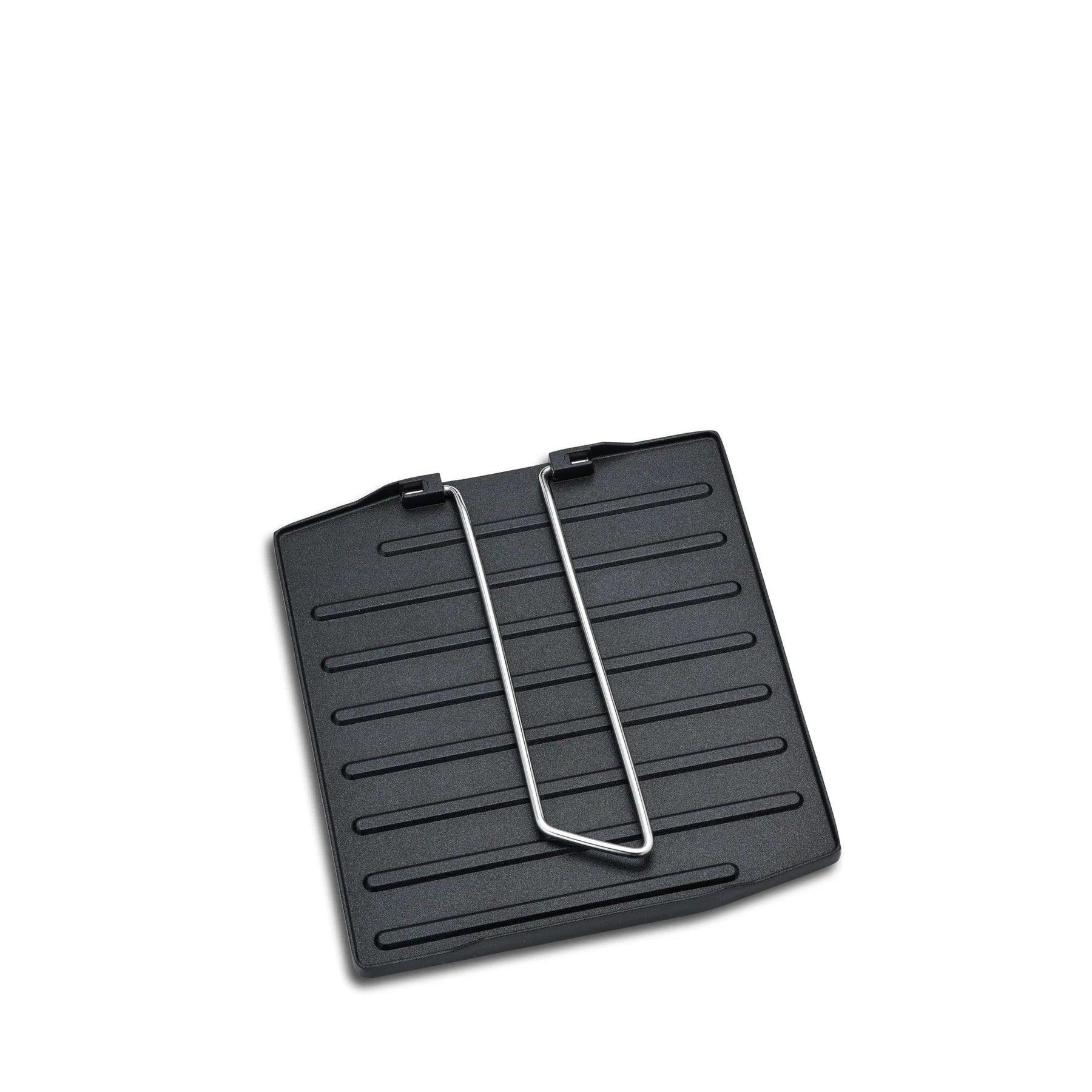 Primus Campfire griddle plate with metal handle on white background