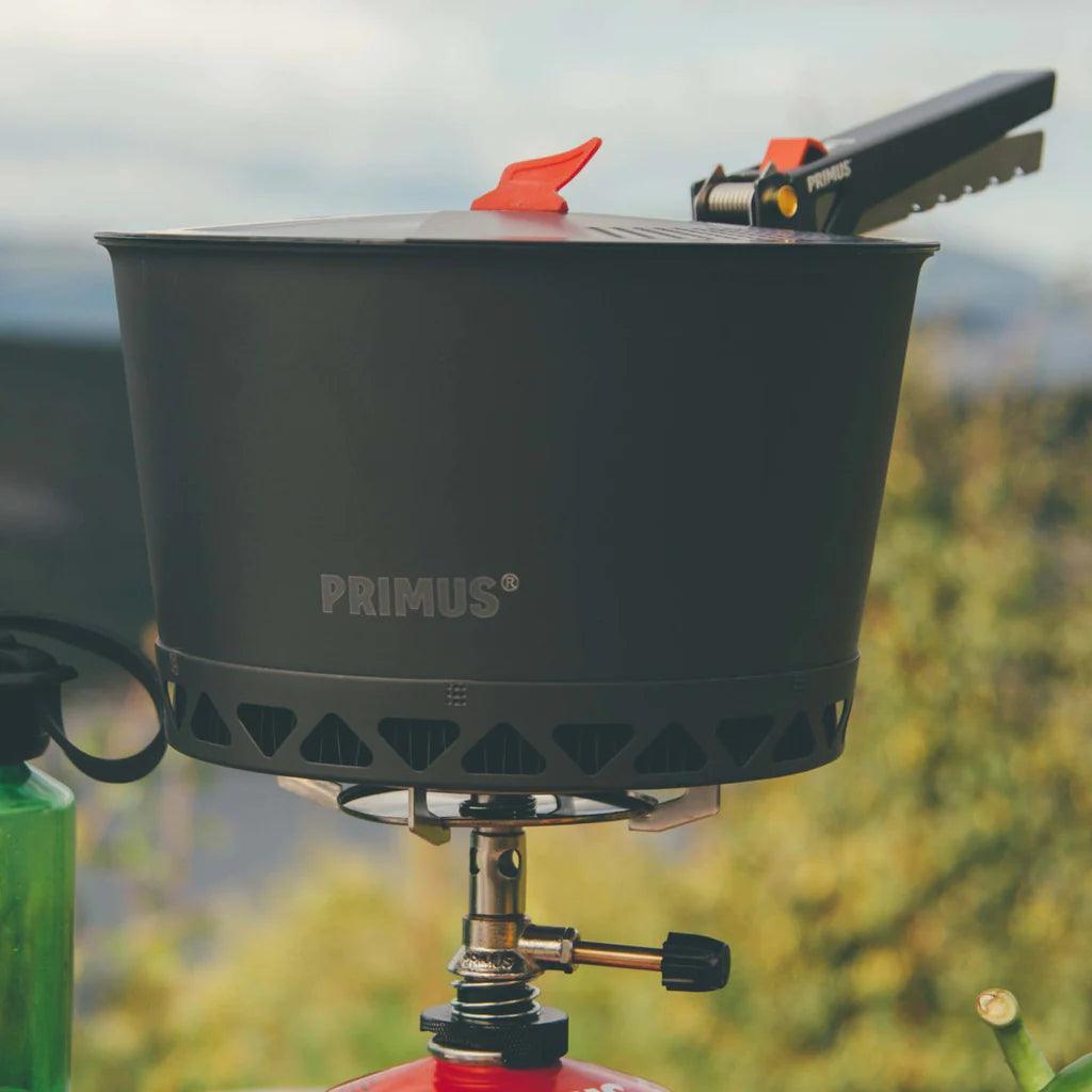Primus PrimeTech camping pot set on portable stove outdoors