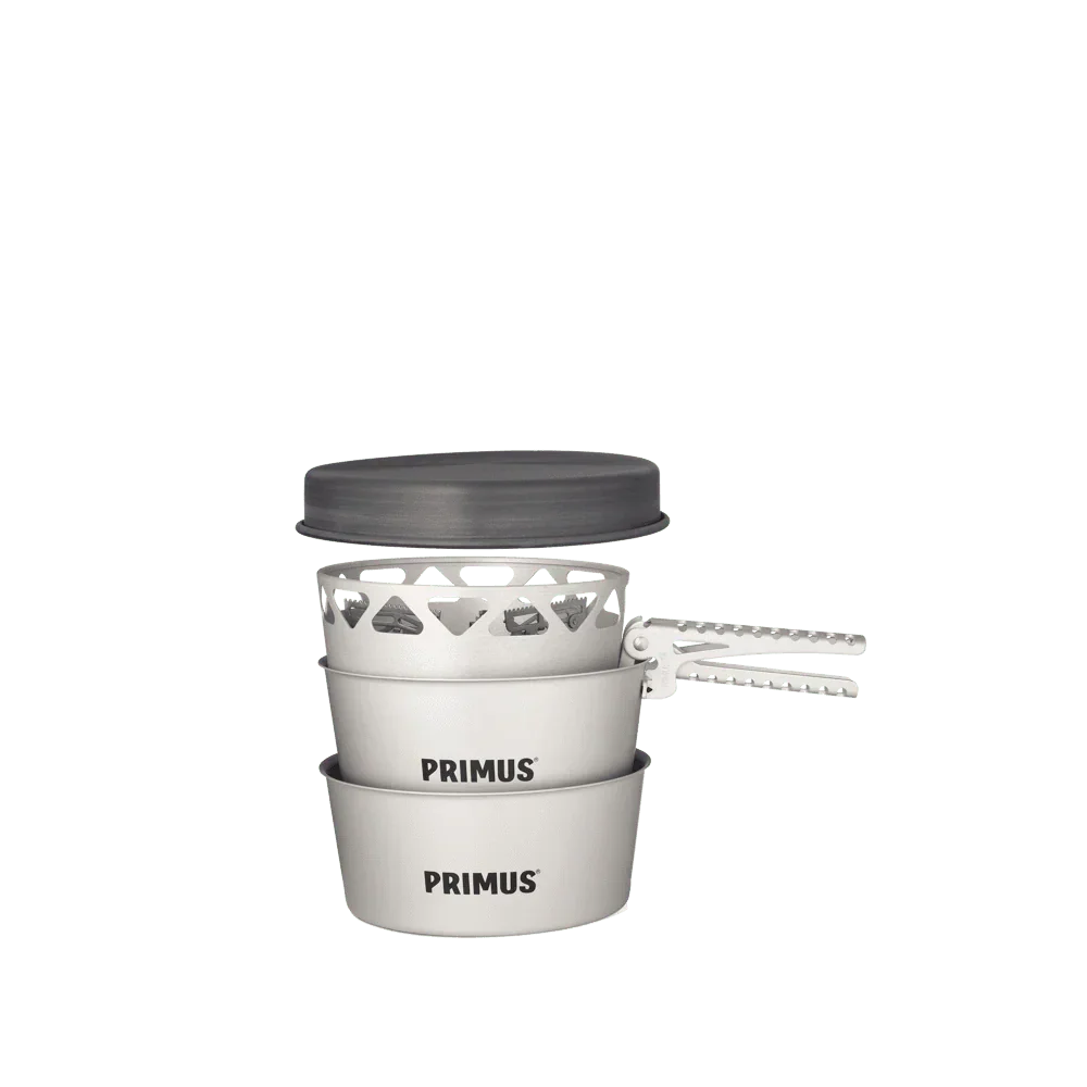 Primus Essential Stove Set with stacked pots, pans, and metal handle on white background