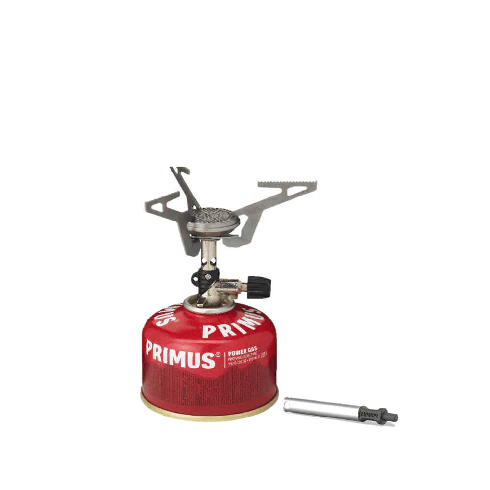 Primus portable camping stove with red gas canister and piezo igniter on white background
