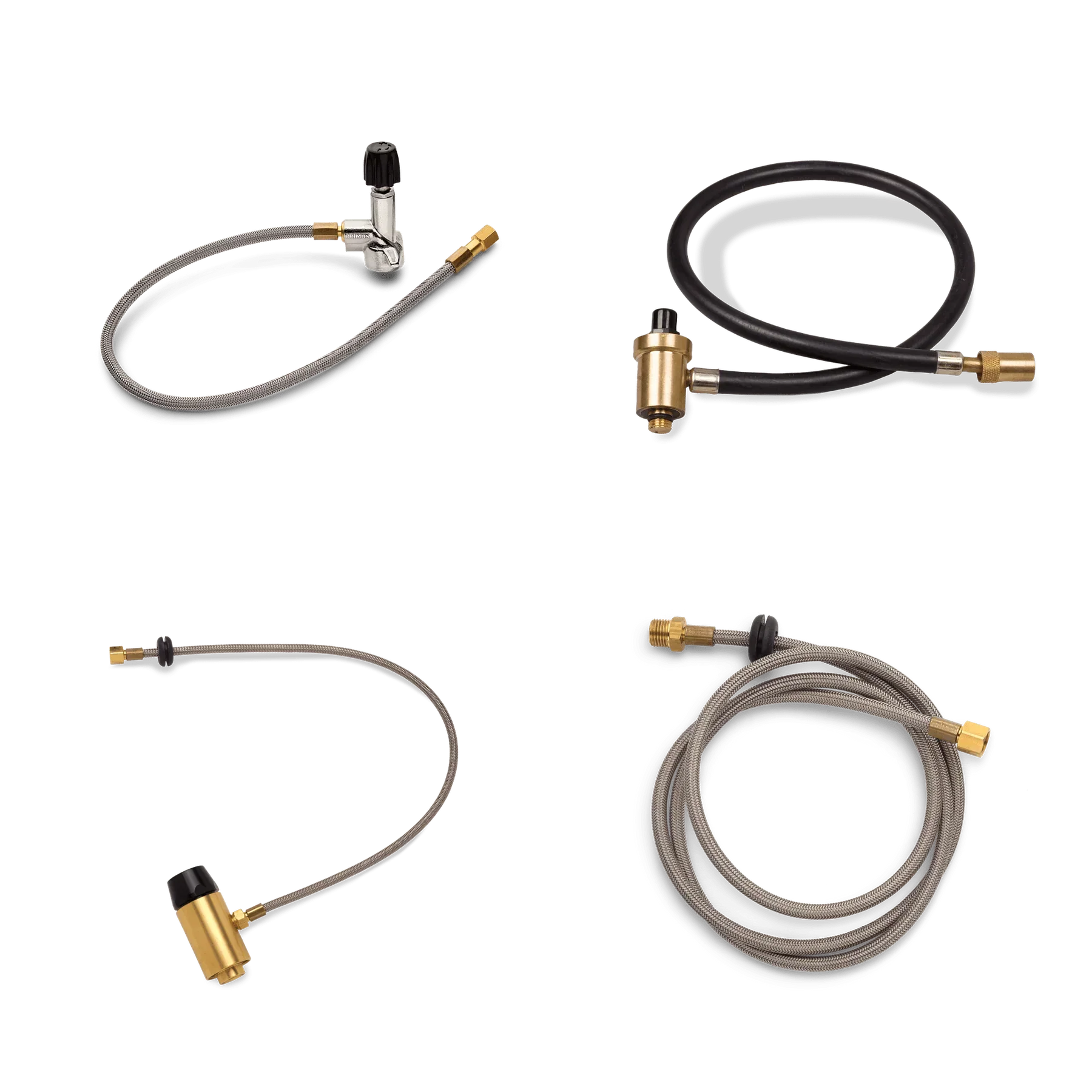 Assorted metal braided gas hoses with brass fittings on a black background