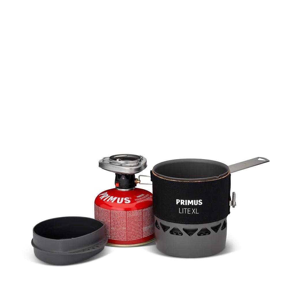 Primus Lite XL portable camping stove system with red fuel canister and black cooking pot