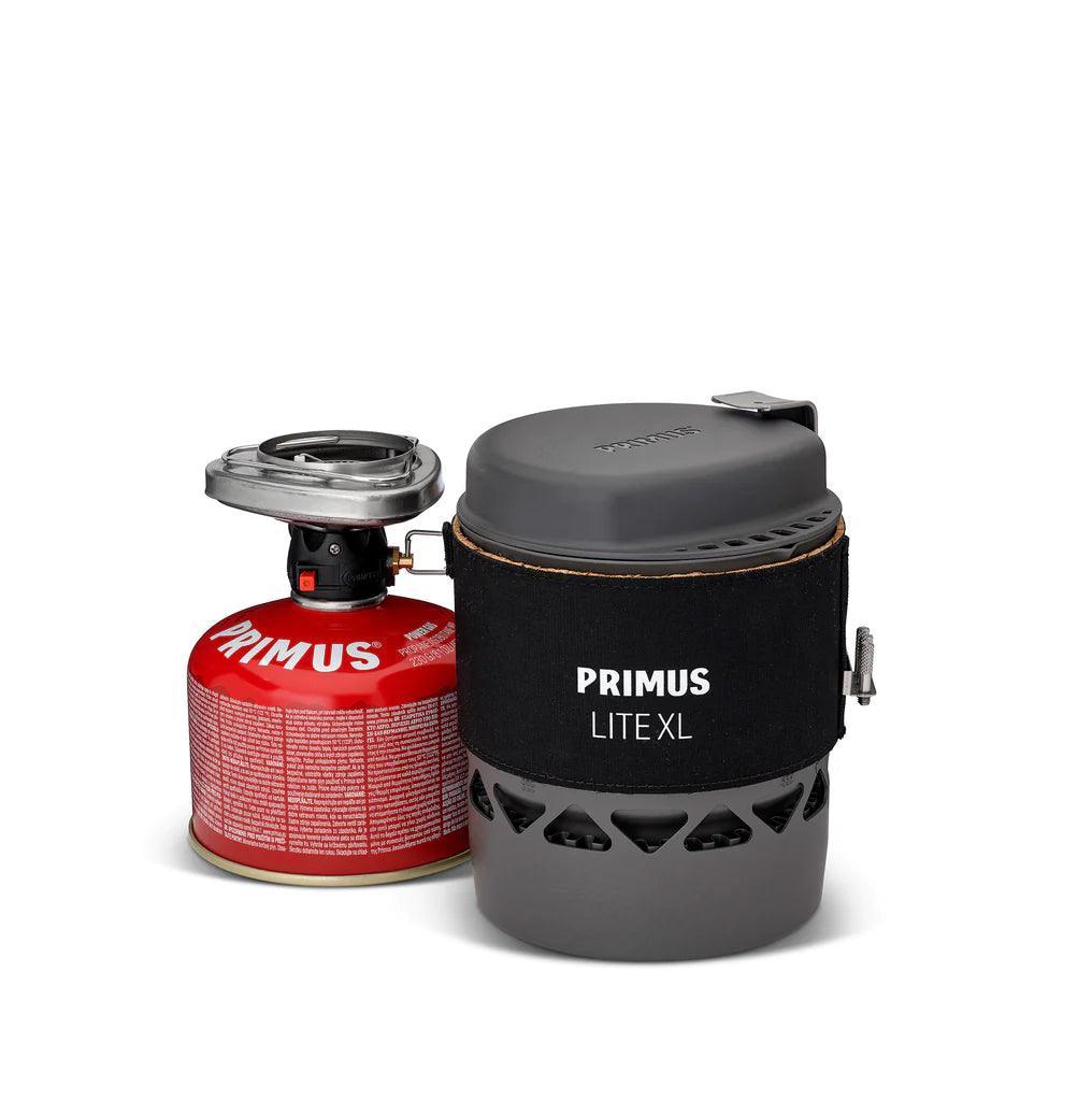 Primus Lite XL camping stove system with black sleeve and red fuel canister
