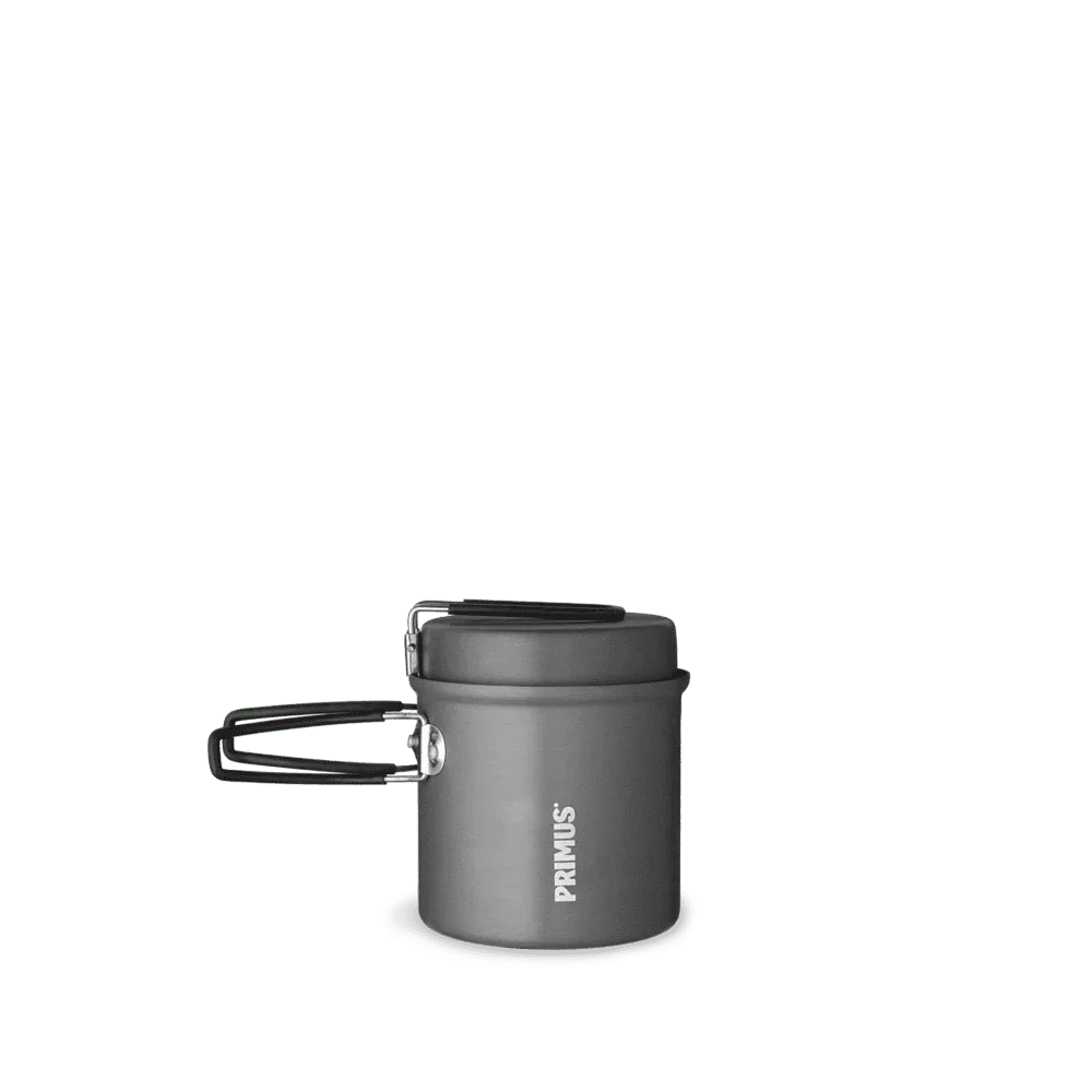 Primus gray camping kettle with lid and folding handle on white background