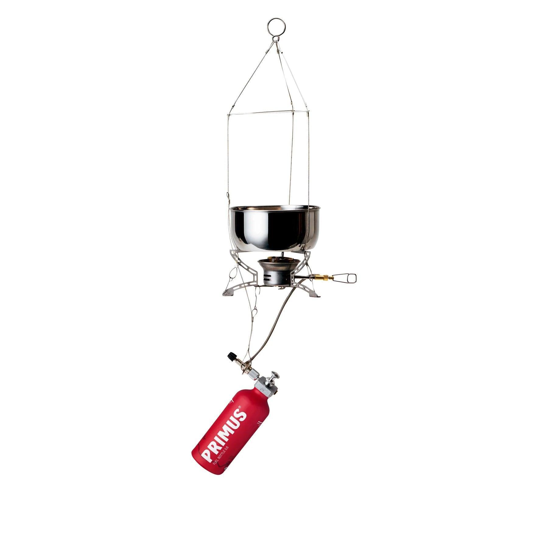 Primus suspension kit for stoves with red fuel bottle and metal cooking pot on white background
