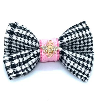 Black and white houndstooth bow with pink center and gold bee brooch accent