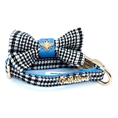 Houndstooth dog collar with bow tie, gold hardware, blue accents, and gold Pawtissimo tag