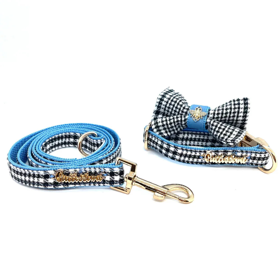 Blue and black houndstooth dog leash and collar set with gold hardware and bow tie.