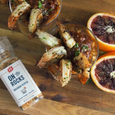 Grilled shrimp cocktail with PS Seasoning On the Rocks Bourbon Pepper, blood oranges on wood