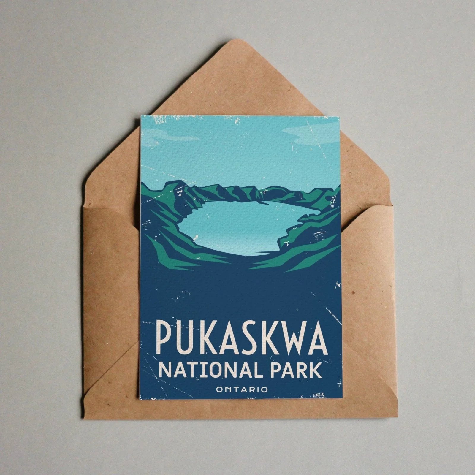 Pukaskwa National Park Ontario postcard with illustrated lake and mountains in envelope