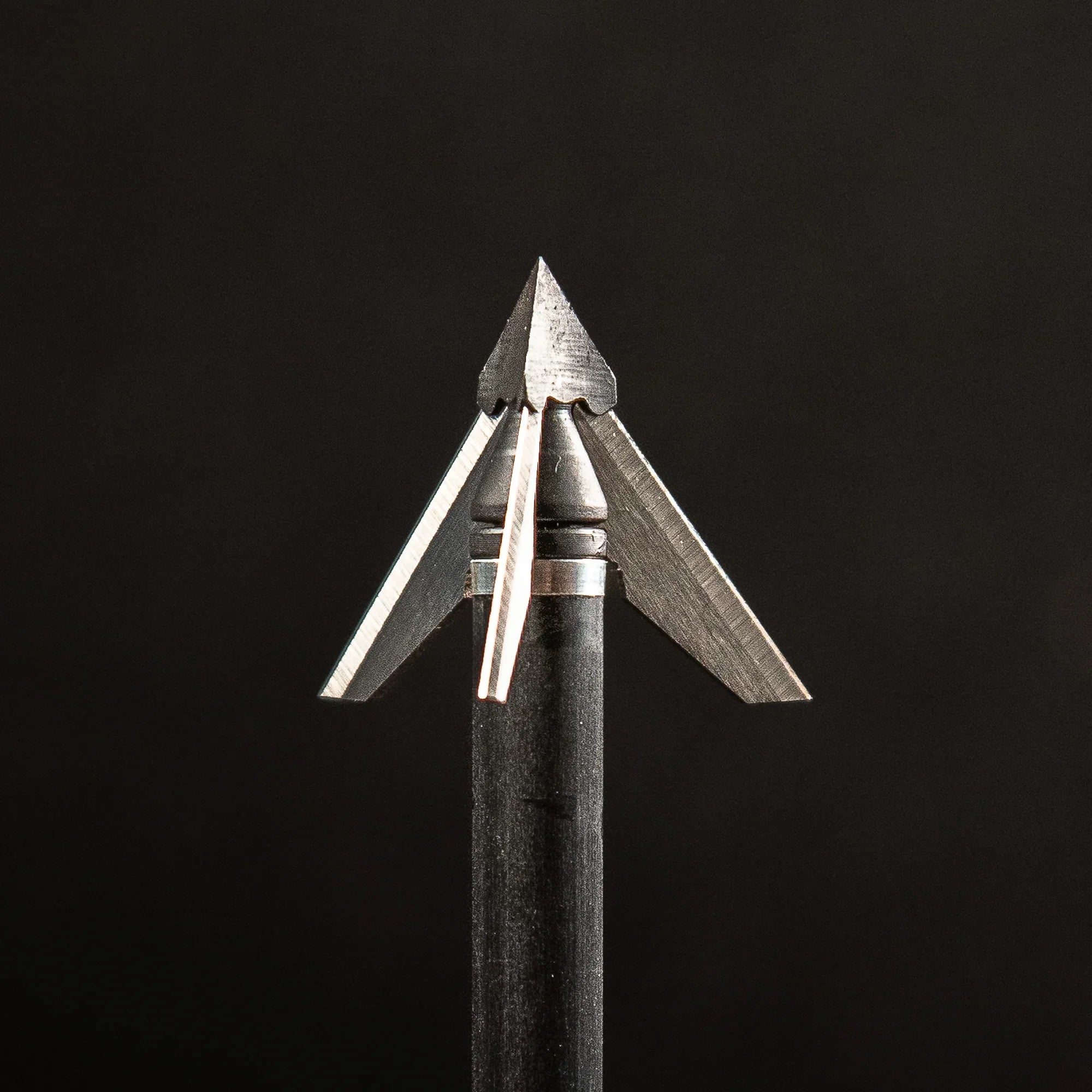 Exodus broadhead arrow tip with three sharp stainless steel blades on black background