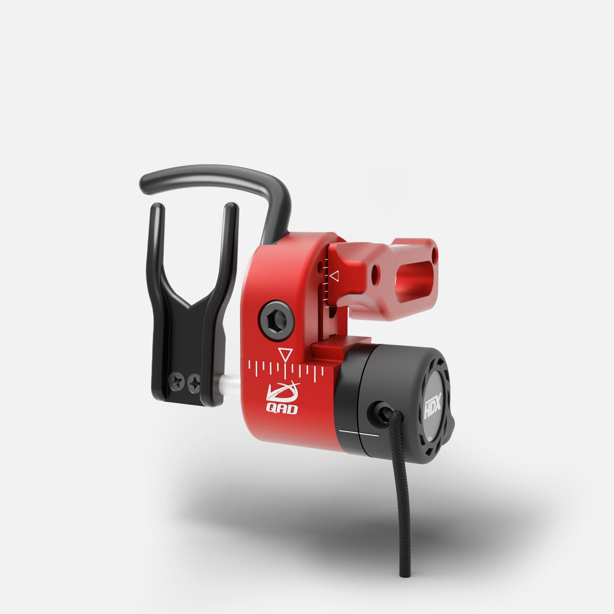 Red QAD HDX arrow rest with black fork on white background, archery accessory close-up