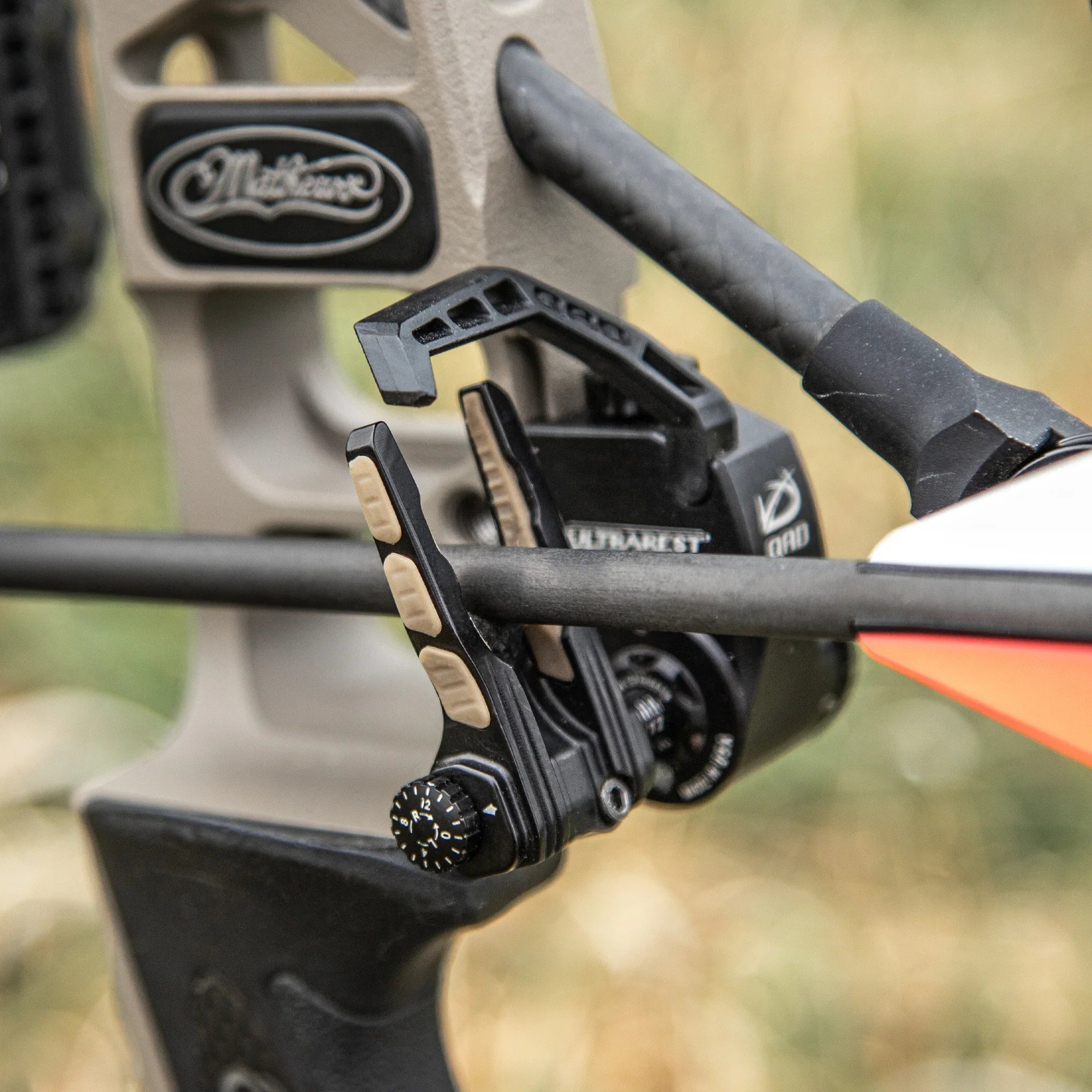 Mathews compound bow with arrow rest and carbon arrow close-up outdoors