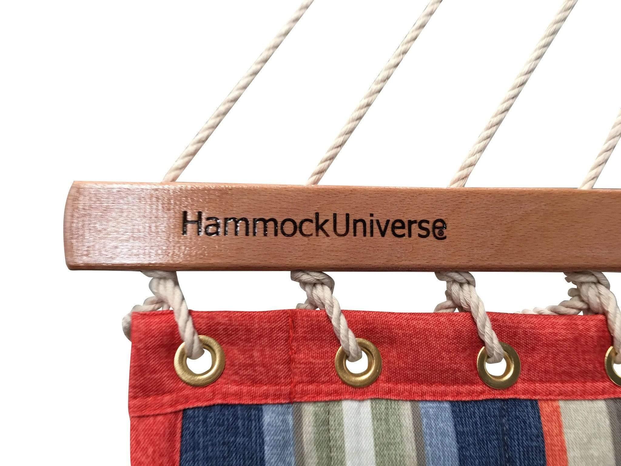 Quilted striped red and blue hammock with wood spreader bar and Hammock Universe logo