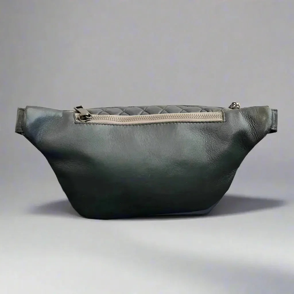 Quilted sheep leather waist bag with zipper, black purse on gray background