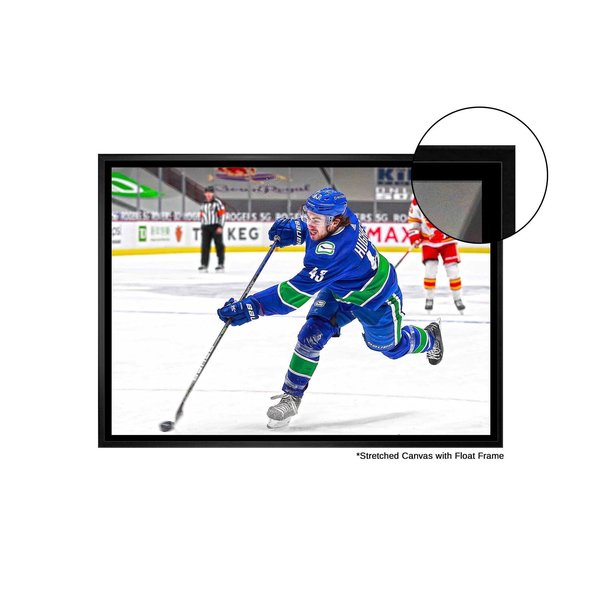 Hockey player in blue jersey shooting puck on stretched canvas with black float frame