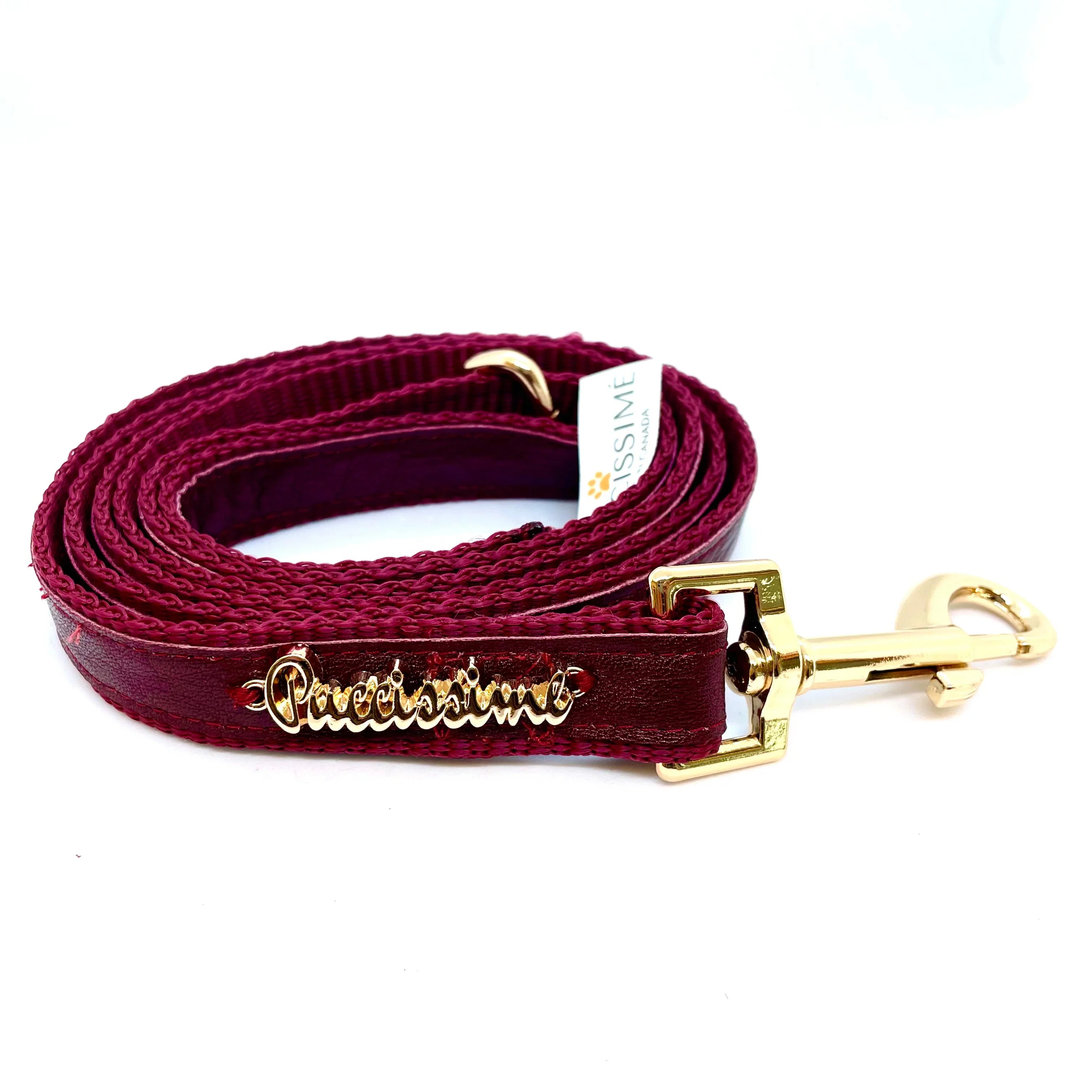 Burgundy dog leash with gold hardware and Precissime label on white background