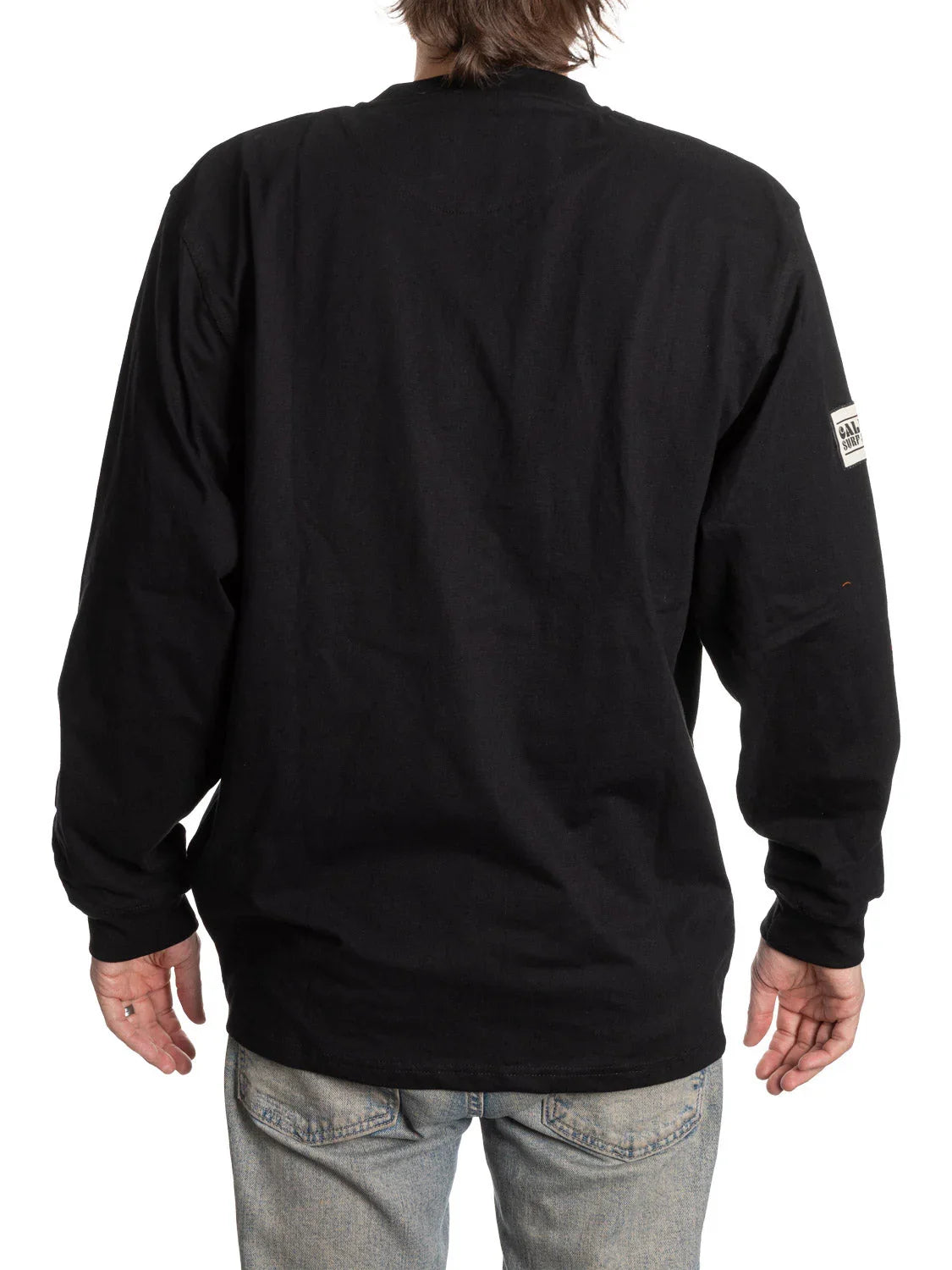 Back view of person wearing a black Canucks Henley long sleeve shirt and jeans