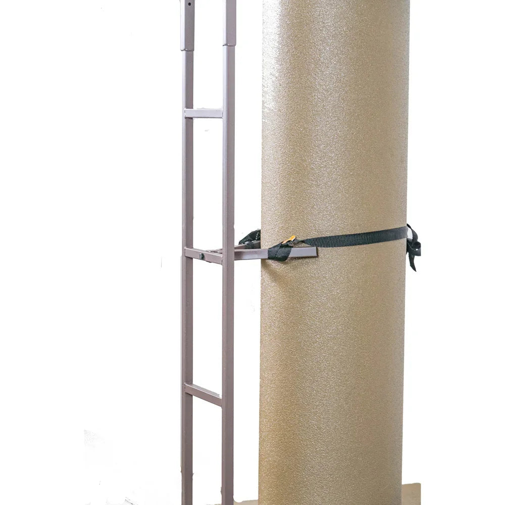 Hand truck securing a large foam roll with a black strap on a white background