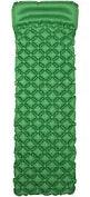Green inflatable camping sleeping pad with built-in pillow and geometric pattern