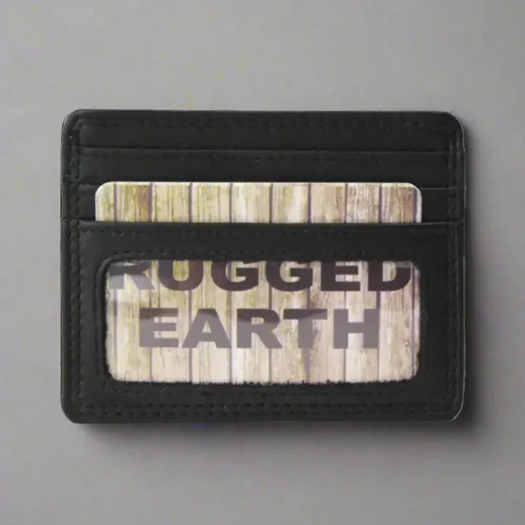 Black leather card holder wallet with visible RUGGED EARTH branded card on gray background