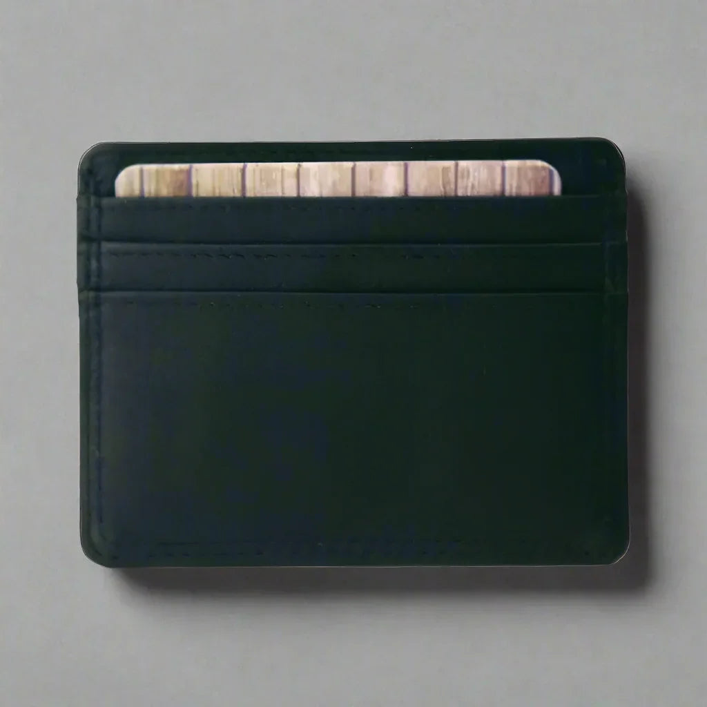 Black leather men's credit card wallet with visible card slots on a gray background