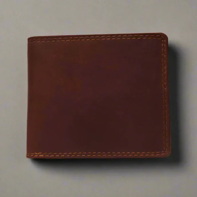 Men's brown leather billfold wallet with visible stitching on a neutral background