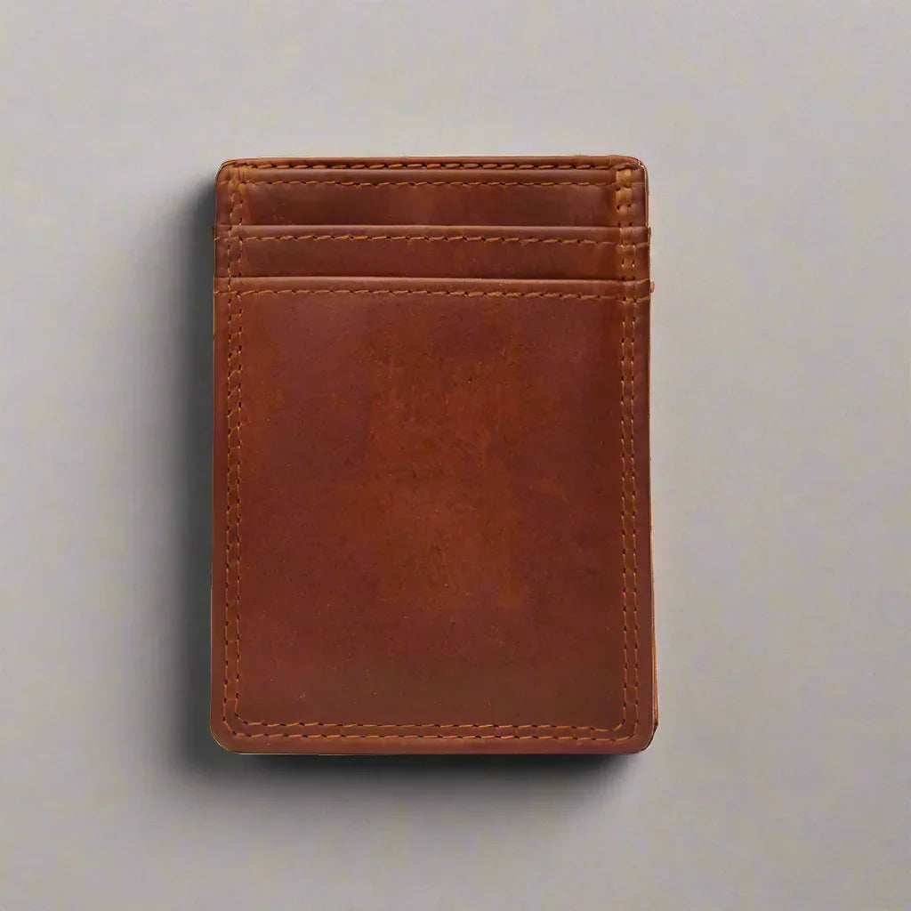 Brown leather men's money clip wallet with card slots on a light background